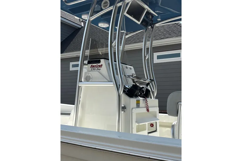 Slide: The Image of 2022 Bay Rider 239 Bay boat console with steering wheel and controls. - 12