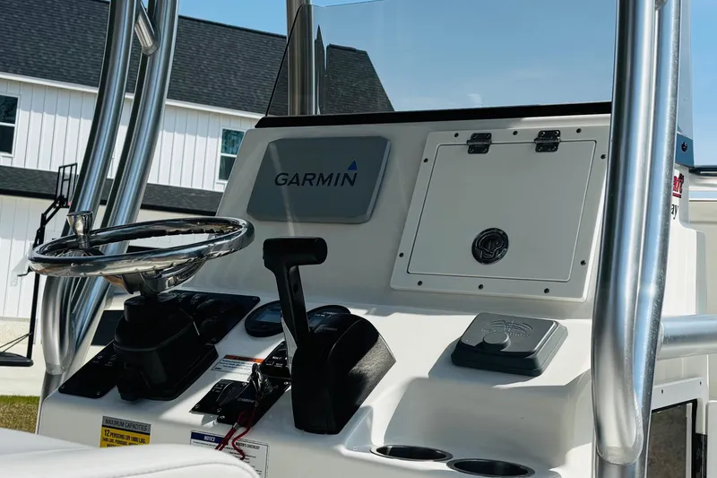 Slide: The Image of 2022 Bay Rider 239 Bay boat console with Garmin navigation system and steering wheel. - 17