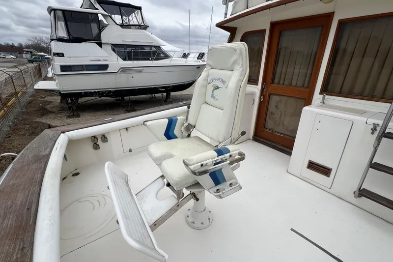 Slide: The Image of 1989 Egg Harbor 35 Sport Fisherman boat with fishing chair on deck. - 2