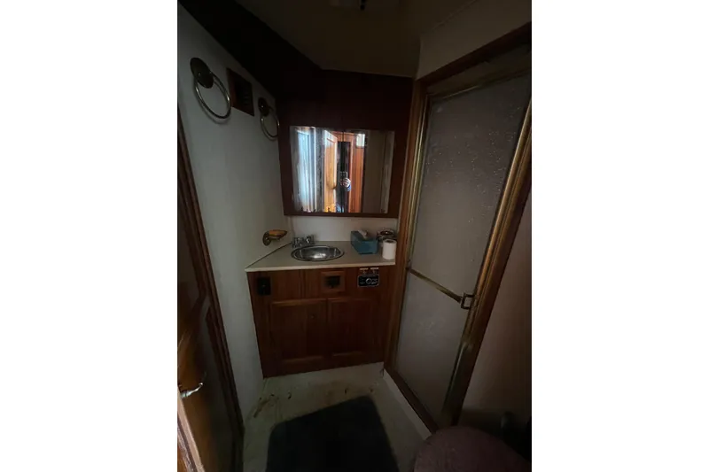 Slide: The Image of Bathroom interior of 1989 Egg Harbor 35 Sport Fisherman with sink and shower. - 22