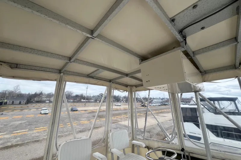 Slide: The Image of Interior view of 1989 Egg Harbor 35 Sport Fisherman boat with helm and seating. - 32