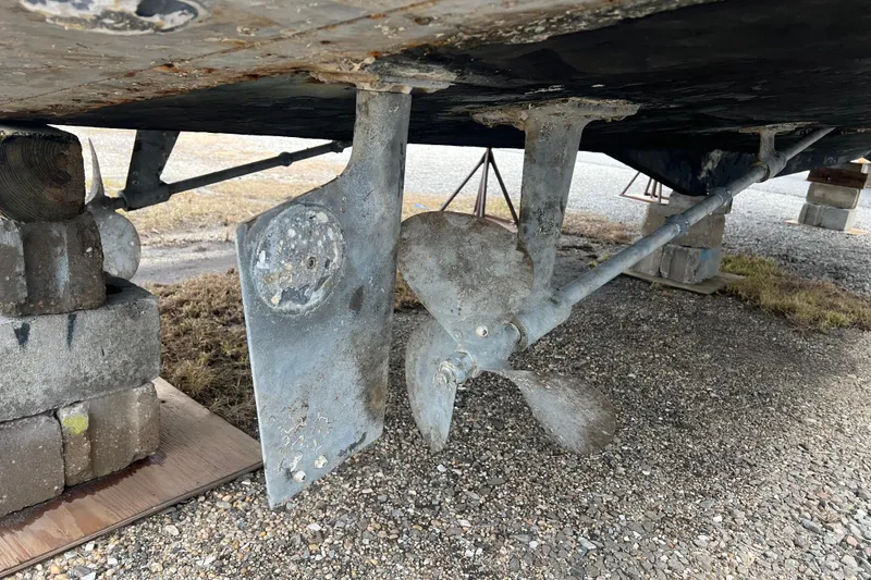 Slide: The Image of Underneath view of a 1989 Egg Harbor 35 Sport Fisherman boat showing propeller and rudder. - 37