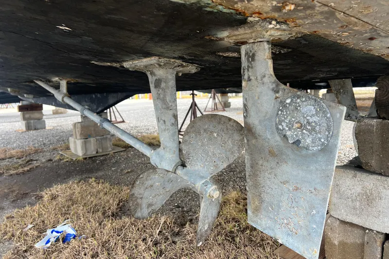 Slide: The Image of 1989 Egg Harbor 35 Sport Fisherman propeller and rudder detail on dry dock. - 39
