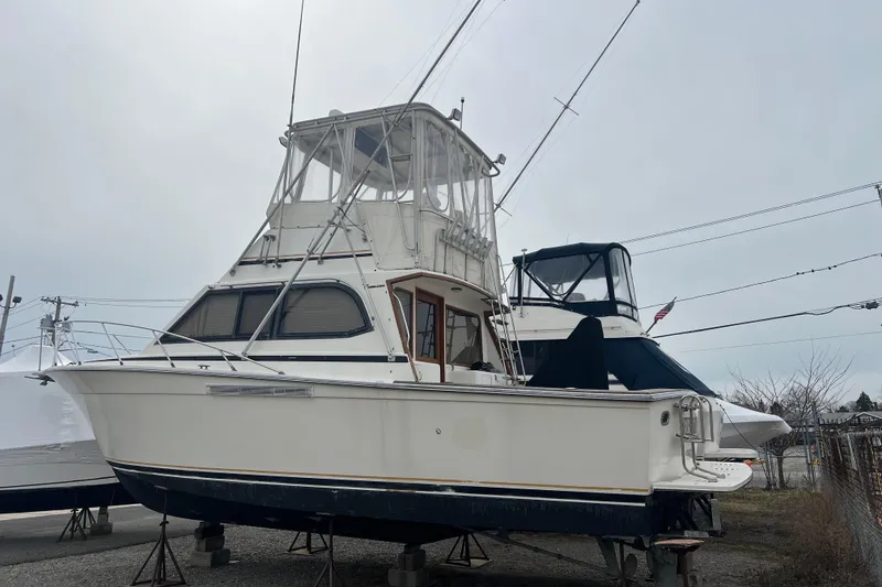 Slide: The Image of 1989 Egg Harbor 35 Sport Fisherman boat on dry dock, side view. - 4