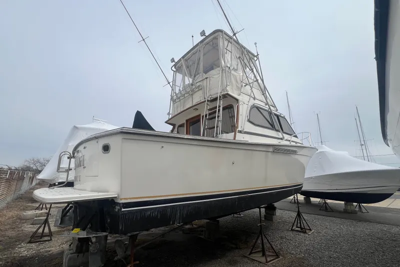Slide: The Image of 1989 Egg Harbor 35 Sport Fisherman boat on dry dock, side view. - 5