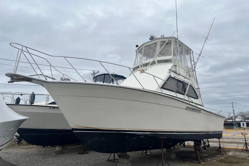 Slide: The Image of 1989 Egg Harbor 35 Sport Fisherman boat on stands, ready for maintenance. - 6