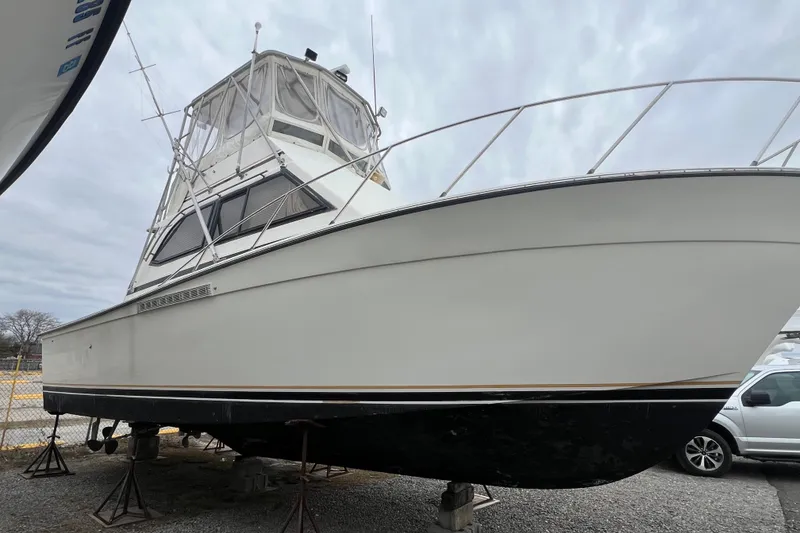 Slide: The Image of 1989 Egg Harbor 35 Sport Fisherman boat on stands, side view. - 7