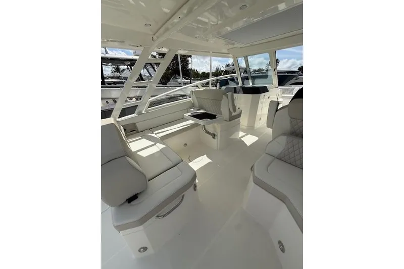 Slide: The Image of Luxurious interior of 2026 World Cat 400 DC-X Island boat with plush seating. - 12