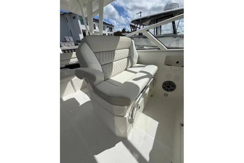 Slide: The Image of Luxurious seating on the 2026 World Cat 400 DC-X Island boat, featuring elegant upholstery. - 13
