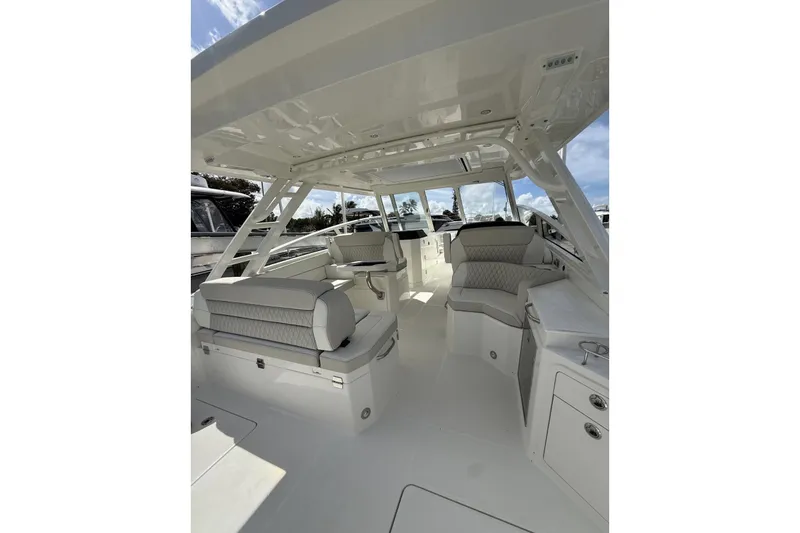 Slide: The Image of Luxurious interior of 2026 World Cat 400 DC-X Island boat with plush seating and modern design. - 15