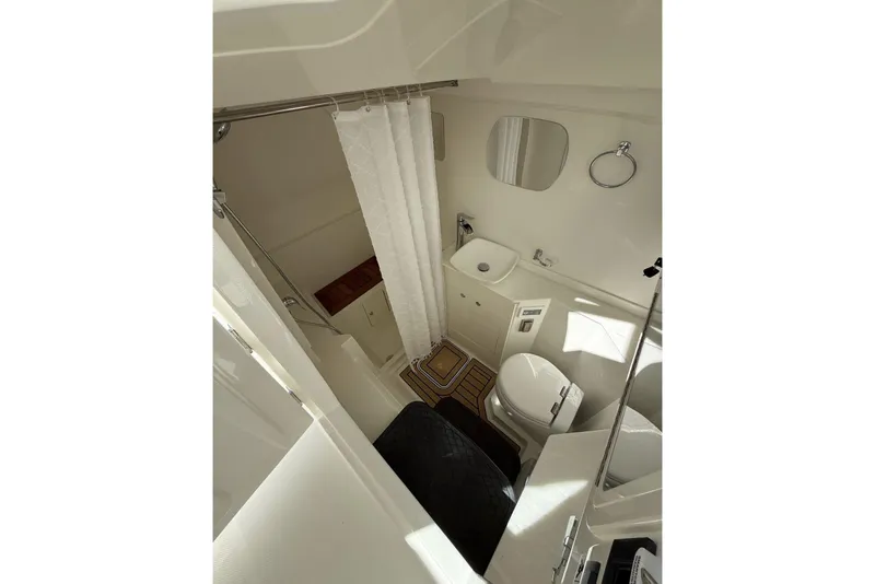 Slide: The Image of Luxurious bathroom in 2026 World Cat 400 DC-X Island boat, featuring modern fixtures and elegant design. - 22