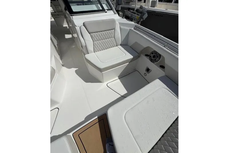Slide: The Image of Luxurious seating on 2026 World Cat 400 DC-X Island boat, featuring modern design and comfort. - 8