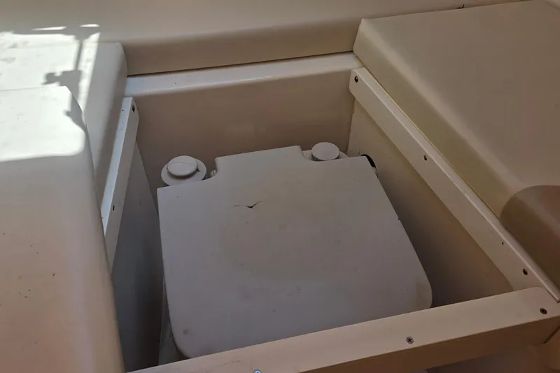 Slide: The Image of 2006 Boston Whaler 205 Conquest boat on trailer under blue sky. - 12