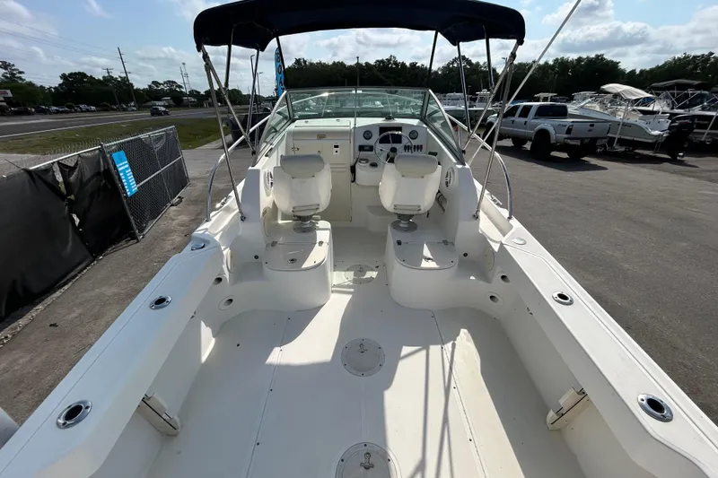 Slide: The Image of 2006 Boston Whaler 205 Conquest boat interior with seating and steering console. - 16