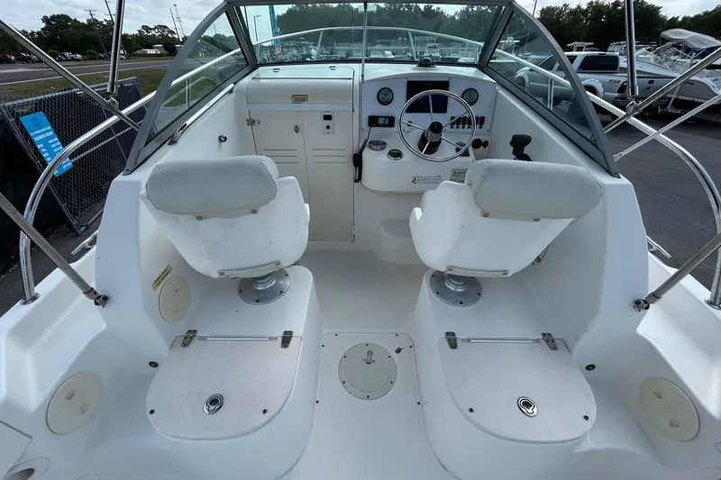 Slide: The Image of 2006 Boston Whaler 205 Conquest boat interior with dual seats and steering console. - 17