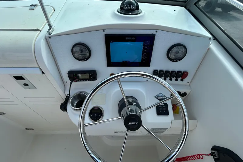 Slide: The Image of Helm of a 2006 Boston Whaler 205 Conquest with navigation system. - 21