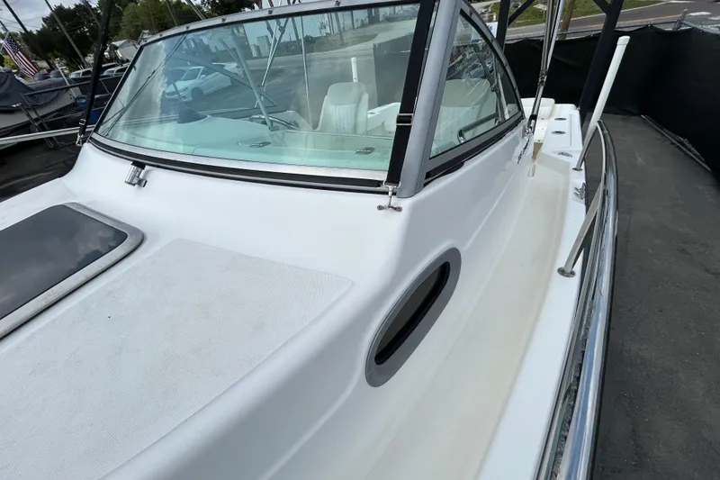 Slide: The Image of 2006 Boston Whaler 205 Conquest boat, side view with windshield. - 29