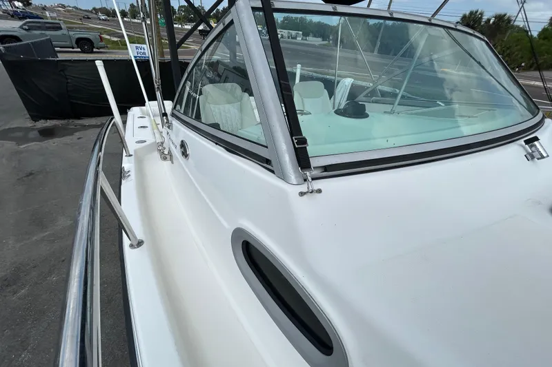 Slide: The Image of 2006 Boston Whaler 205 Conquest boat, side view on parking lot. - 30