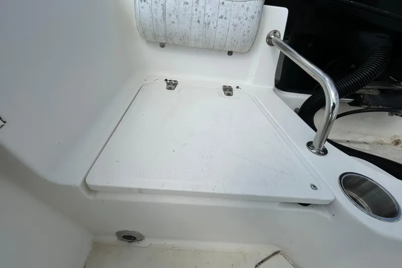 Slide: The Image of 2006 Boston Whaler 205 Conquest boat interior with seat and stainless steel handle. - 41