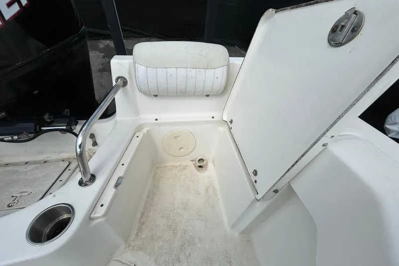 Slide: The Image of 2006 Boston Whaler 205 Conquest boat interior with open storage compartment. - 45