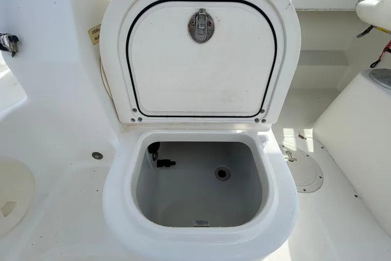 Slide: The Image of Open storage compartment on a 2006 Boston Whaler 205 Conquest boat. - 48