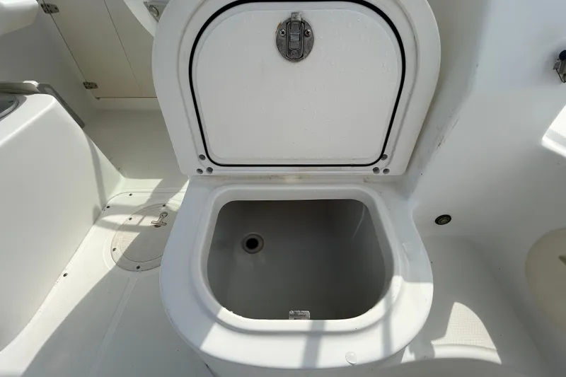 Slide: The Image of Open storage compartment on a 2006 Boston Whaler 205 Conquest boat. - 51