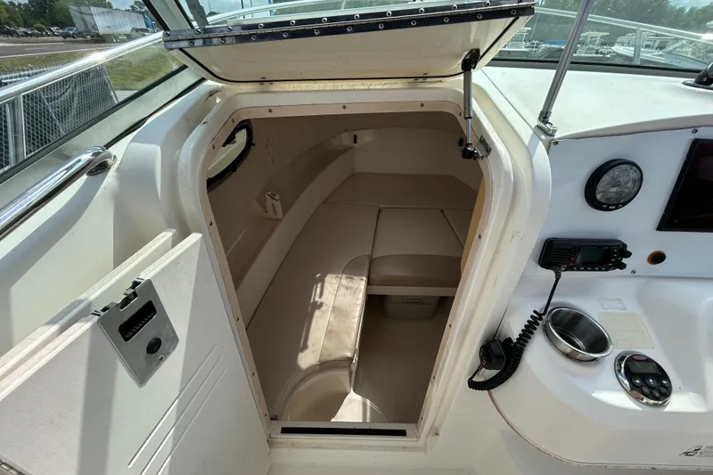 Slide: The Image of Interior of 2006 Boston Whaler 205 Conquest with cabin and helm console. - 55
