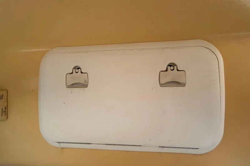 Slide: The Image of Hatch cover on a 2006 Boston Whaler 205 Conquest boat. - 57