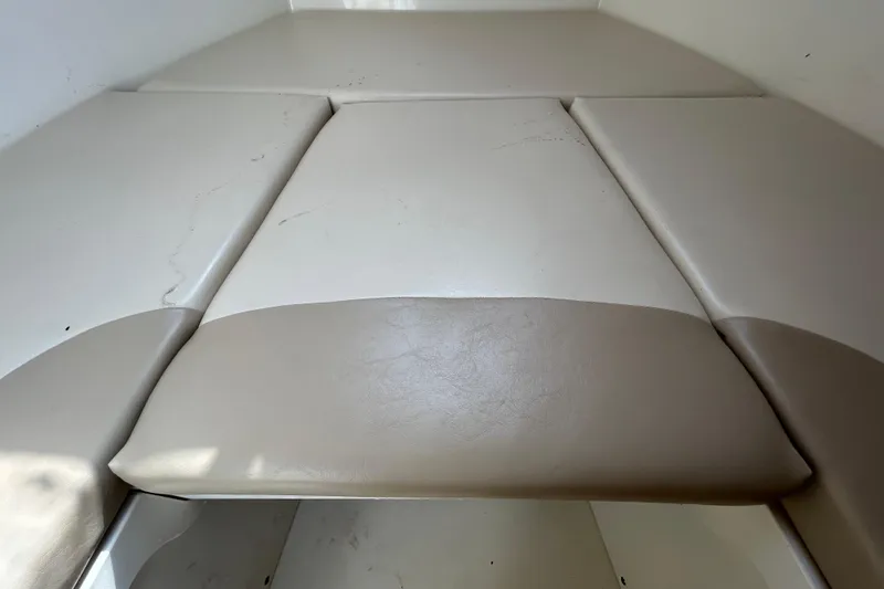 Slide: The Image of Interior of 2006 Boston Whaler 205 Conquest with cushioned seating. - 65