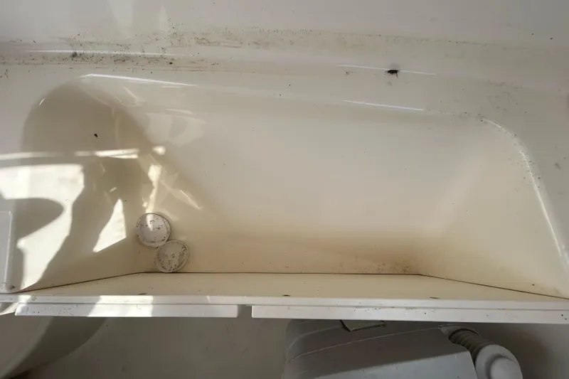 Slide: The Image of Interior of a 2006 Boston Whaler 205 Conquest boat, slightly dirty. - 69