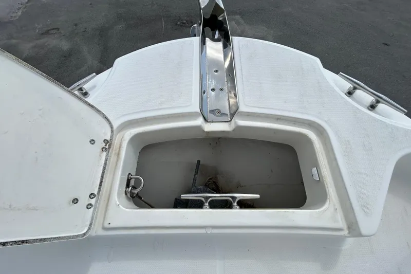 Slide: The Image of Anchor compartment of a 2006 Boston Whaler 205 Conquest boat. - 72