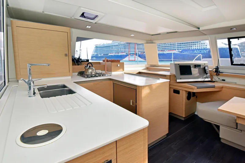 Slide: The Image of Modern interior of 2024 Fountaine Pajot Astrea 42 catamaran with kitchen and navigation area. - 20
