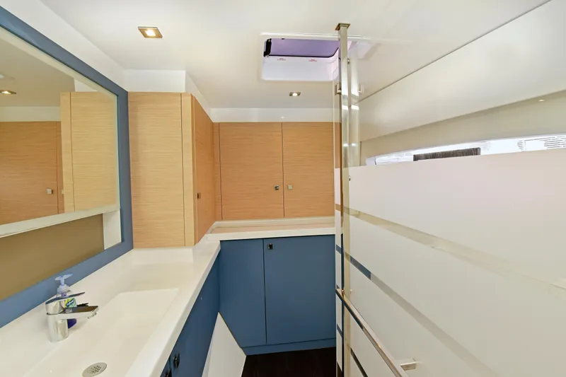 Slide: The Image of Modern bathroom interior of 2024 Fountaine Pajot Astrea 42 yacht, featuring sleek design elements. - 26
