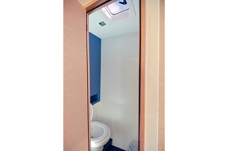 Slide: The Image of Bathroom interior of 2024 Fountaine Pajot Astrea 42 yacht, featuring modern design and skylight. - 30