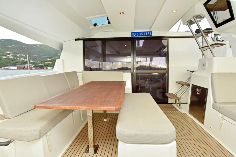 Slide: The Image of 2024 Fountaine Pajot Astrea 42 yacht interior with dining area and modern design. - 5