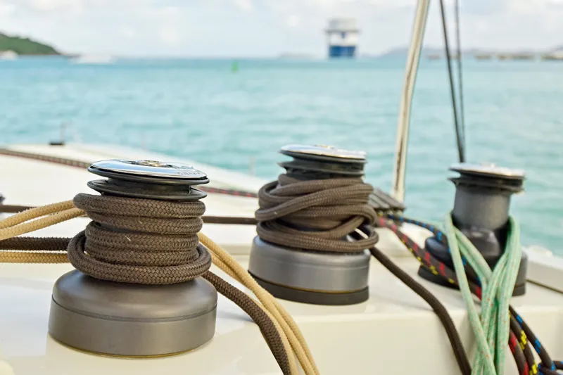 Slide: The Image of Winches and ropes on a 2024 Fountaine Pajot Astrea 42 catamaran, sailing in clear waters. - 15