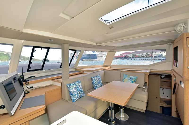 Slide: The Image of Interior of 2024 Fountaine Pajot Astrea 42 catamaran with modern seating and navigation area. - 19