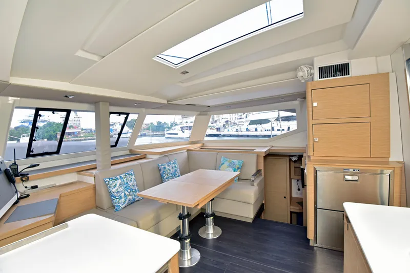 Slide: The Image of Luxurious interior of 2024 Fountaine Pajot Astrea 42 catamaran with modern seating and skylight. - 23