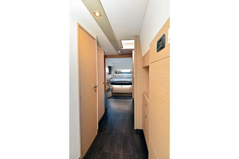 Slide: The Image of Interior view of 2024 Fountaine Pajot Astrea 42 catamaran cabin with modern wood finish. - 25
