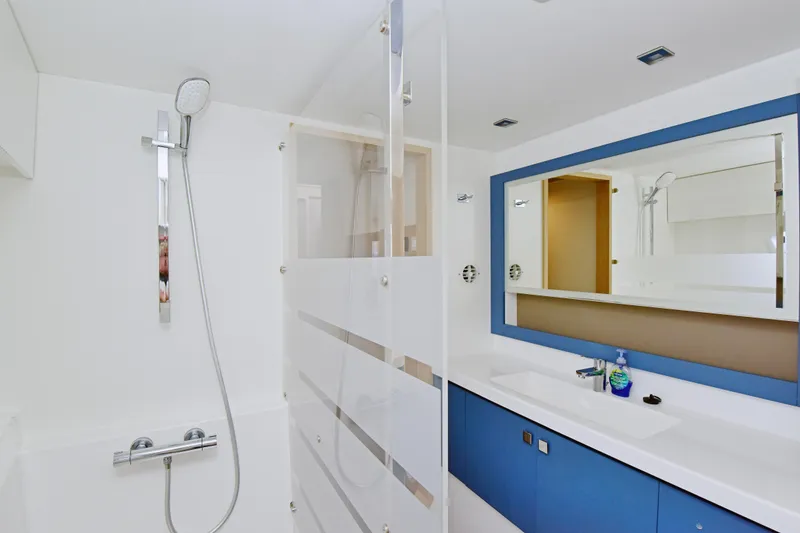 Slide: The Image of Modern bathroom interior on 2024 Fountaine Pajot Astrea 42 yacht, featuring sleek shower and vanity. - 29