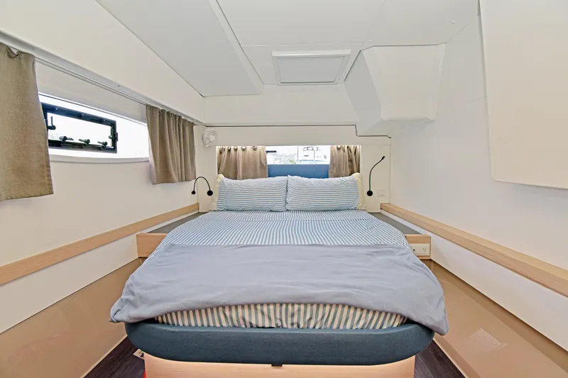 Slide: The Image of 2024 Fountaine Pajot Astrea 42 cabin with cozy bed and modern design. - 32