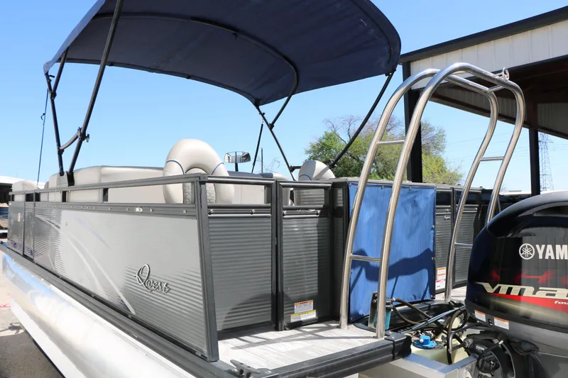 Slide: The Image of 2023 Qwest E820 XRE CR L pontoon boat with Yamaha motor and canopy. - 13