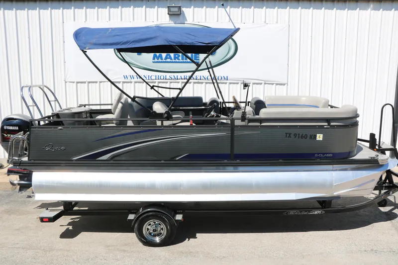 Slide: The Image of 2023 Qwest E820 XRE CR L pontoon boat with Yamaha motor and blue canopy. - 14