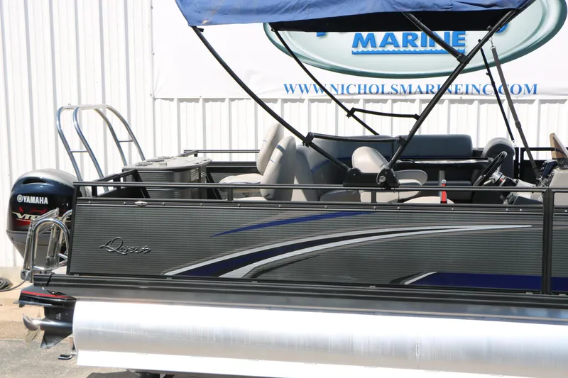 Slide: The Image of 2023 Qwest E820 XRE CR L pontoon boat with Yamaha engine, docked at Nichols Marine. - 15