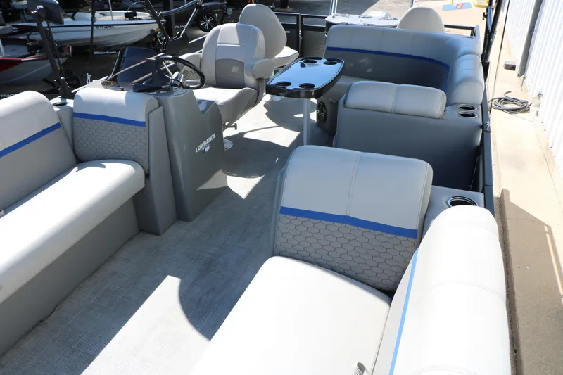 Slide: The Image of Interior of 2023 Qwest E820 XRE CR L pontoon boat with spacious seating and steering console. - 19