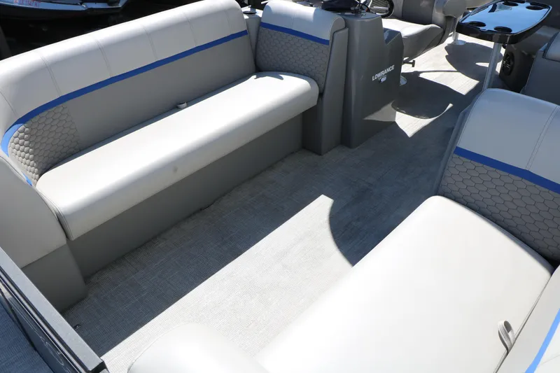 Slide: The Image of Interior of 2023 Qwest E820 XRE CR L pontoon boat with gray seating and blue accents. - 20