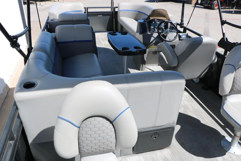 Slide: The Image of Interior of 2023 Qwest E820 XRE CR L pontoon boat with plush seating and modern dashboard. - 22