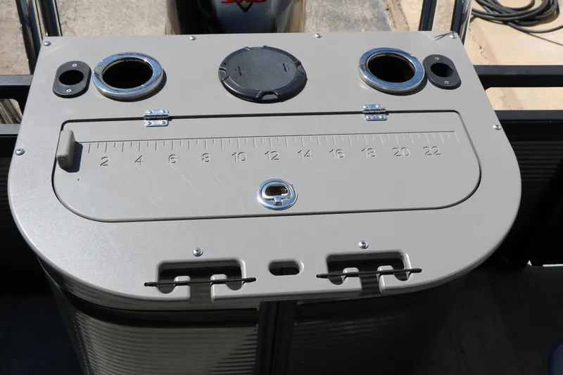 Slide: The Image of Control panel of 2023 Qwest E820 XRE CR L boat with cup holders and measurement scale. - 25