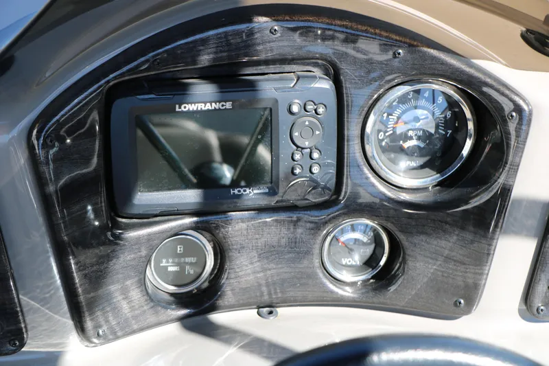 Slide: The Image of Dashboard of 2023 Qwest E820 XRE CR L with Lowrance display and gauges. - 30