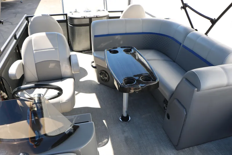 Slide: The Image of Luxurious interior of 2023 Qwest E820 XRE CR L pontoon boat with plush seating and sleek table. - 34